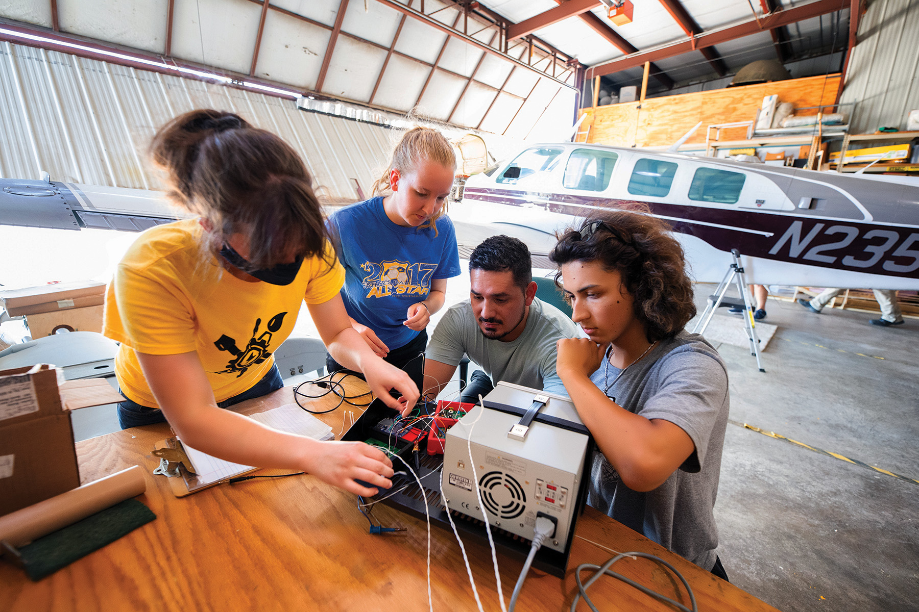 Students in Edge of Space Academy working together on instrument hardware; photo by Justin Torner