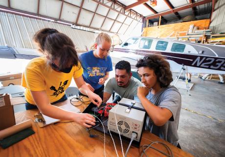 Students in Edge of Space Academy working together on instrument hardware; photo by Justin Torner