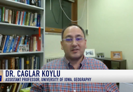 a screenshot of Caglar Koylu and his name card from the news segment