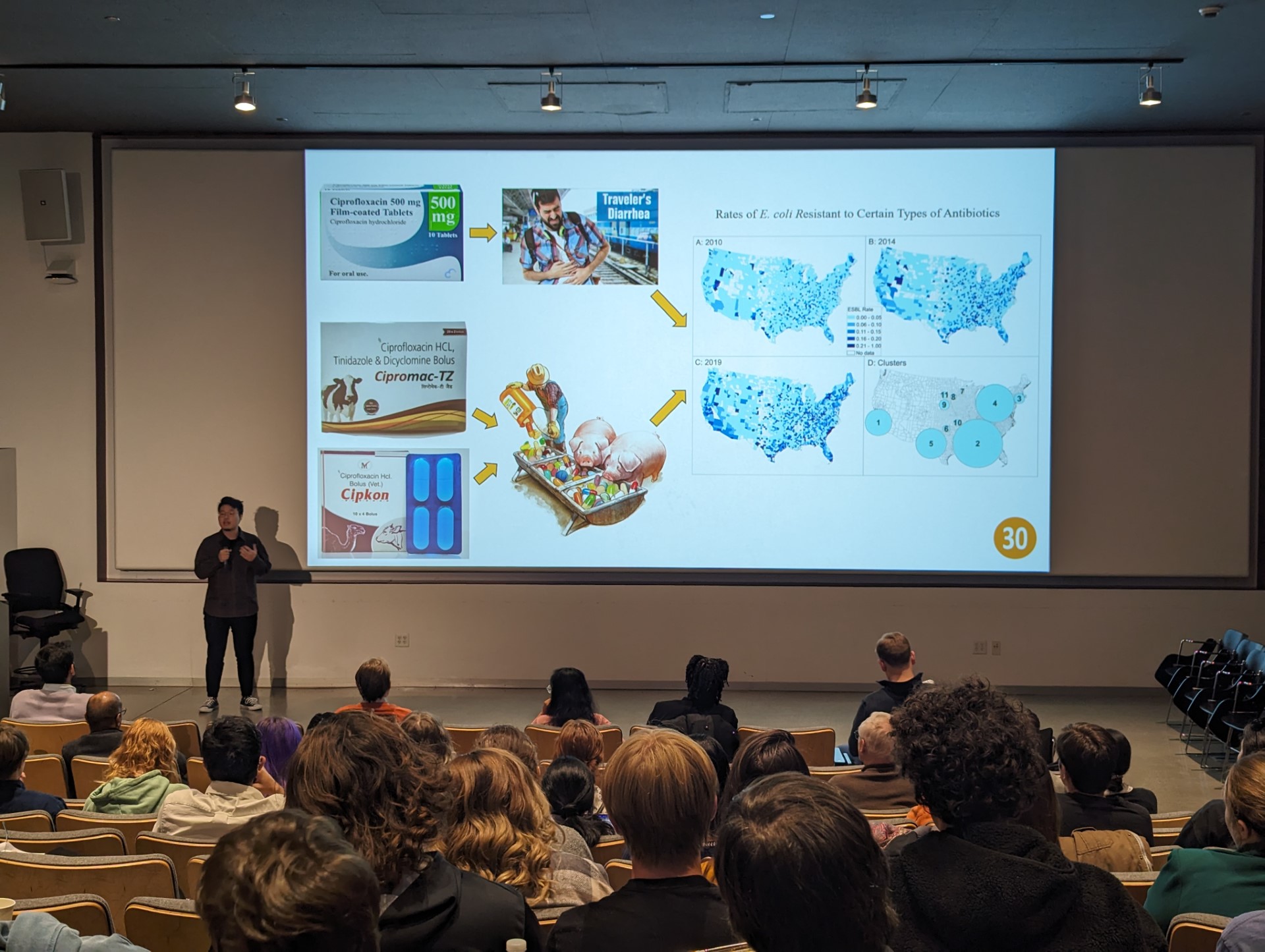a photo of Austin Tang presenting at 3 Minute Thesis on November 10, 2023