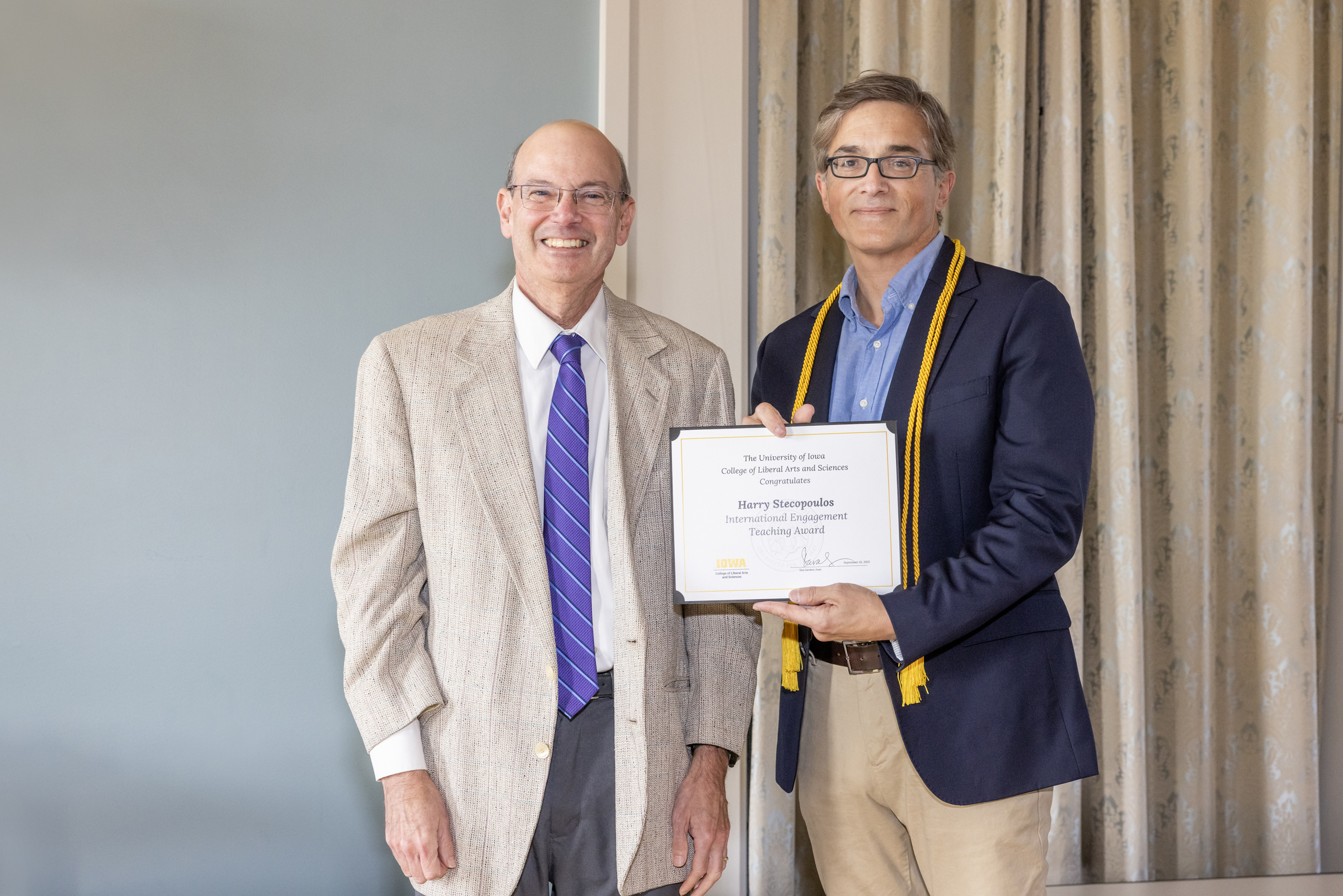 Russ Ganim, left; Harry Stecopolous, holding certificate, right