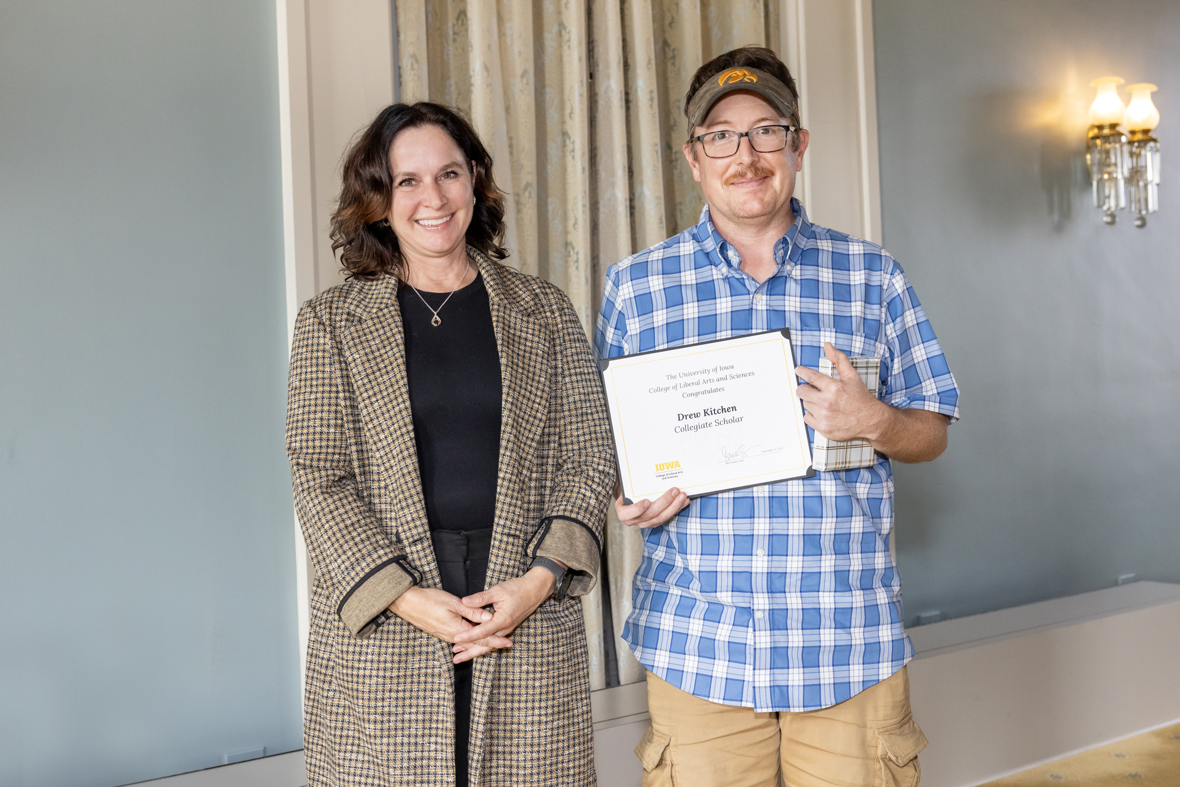 Dean Sara Sanders, left; Drew Kitchen holding certificate, right