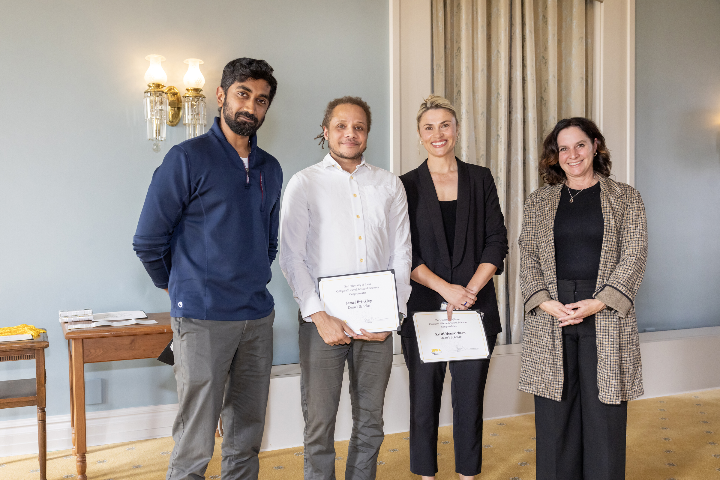 Rishab Nithyanand, left; Jamel Brinkley holding certificate, second from left; Kristi Hendrickson, holding certificate, second from right; Dean Sara Sanders, right