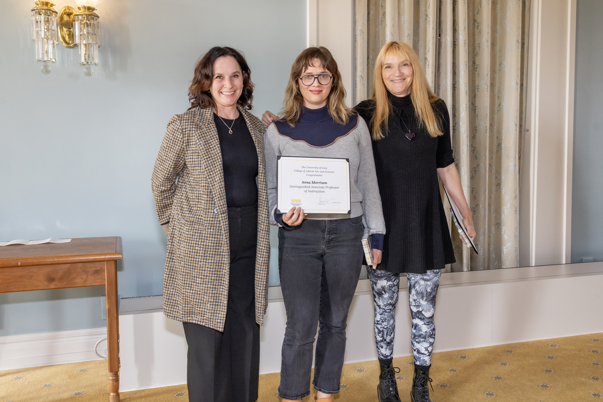 Dean Sara Sanders, left; Anna Morrison, holding certificate, middle; Cinda Coggins-Mosher, right