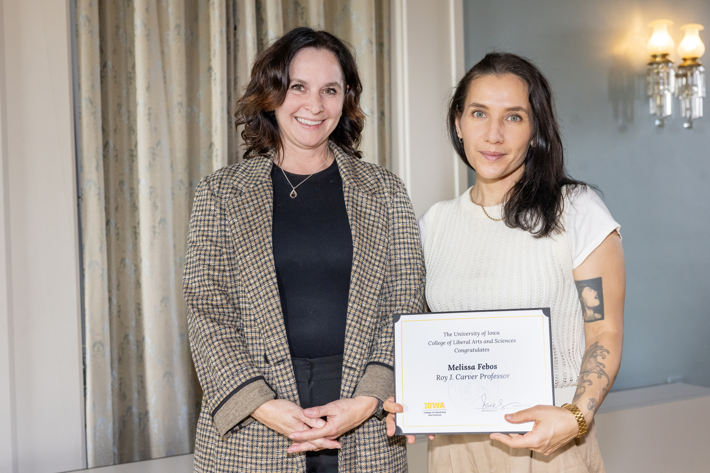 Dean Sara Sanders, left, and Melissa Febos, holding a certificate, right 