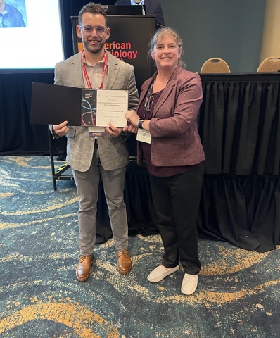 Nate Jenkins receiving research award