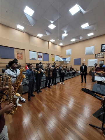 faculty visiting a classroom of jazz students