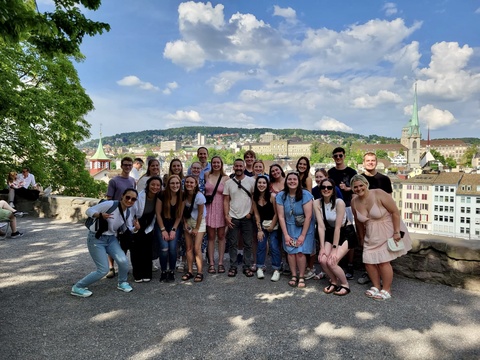A group photo of students posing while traveling in Europe
