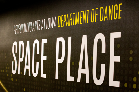 A photograph of the painted wall outside the theater with the words "Space Place"