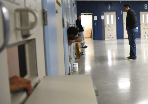 Beth Skinner talking to incarcerated members in a jail 