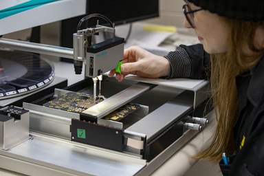 A University of Iowa student works in the Electronics Assembly Shop, which is housed within the Iowa Spaceflight Laboratory.