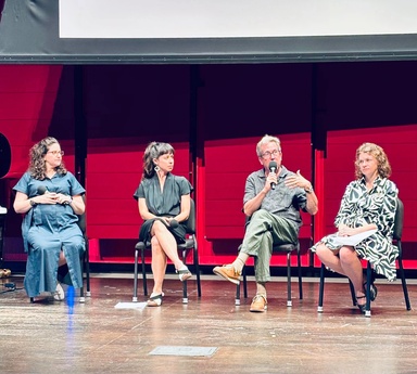 Four people sit on a stage, including Stephanie Miracle, winner of the 2026 Obermann Interdisciplinary Achievement Award. 