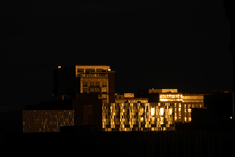 An exterior of Voxman Music Building at night