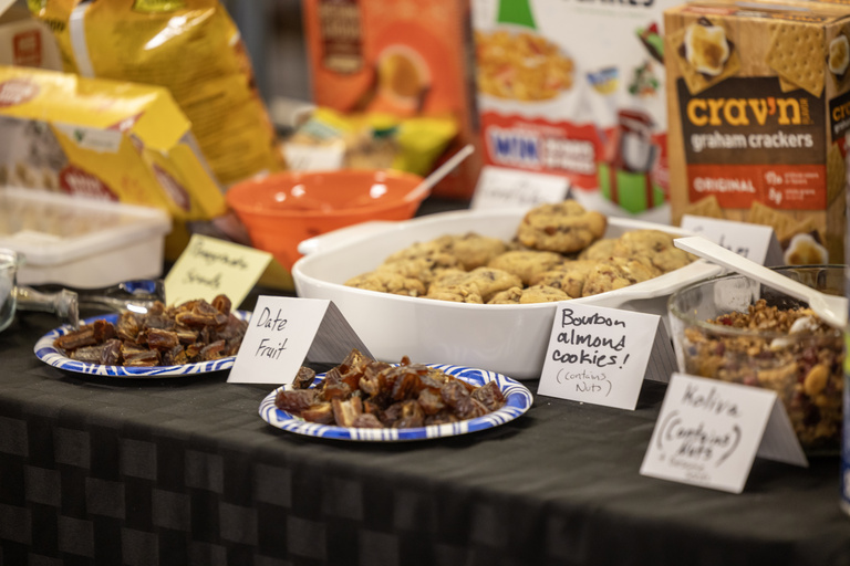 Samples of foods that were presented on in relation to religion are spread out on a table to try following the program