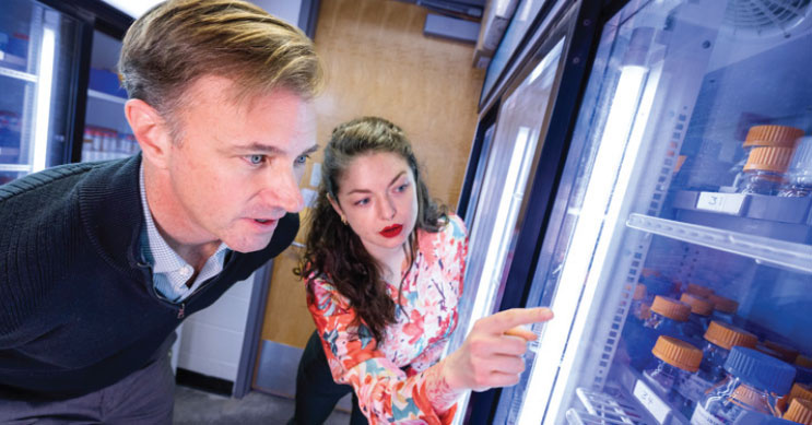 Director Doug Houston and program coordinator Gemma Kerr monitor the inventory at the UI Developmental Studies Hybridoma Bank.