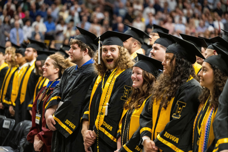 A student makes a silly surprised face at the photographer