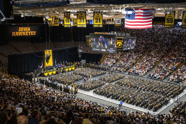 An aerial photo of Commencement showing a large number of graduates and viewers