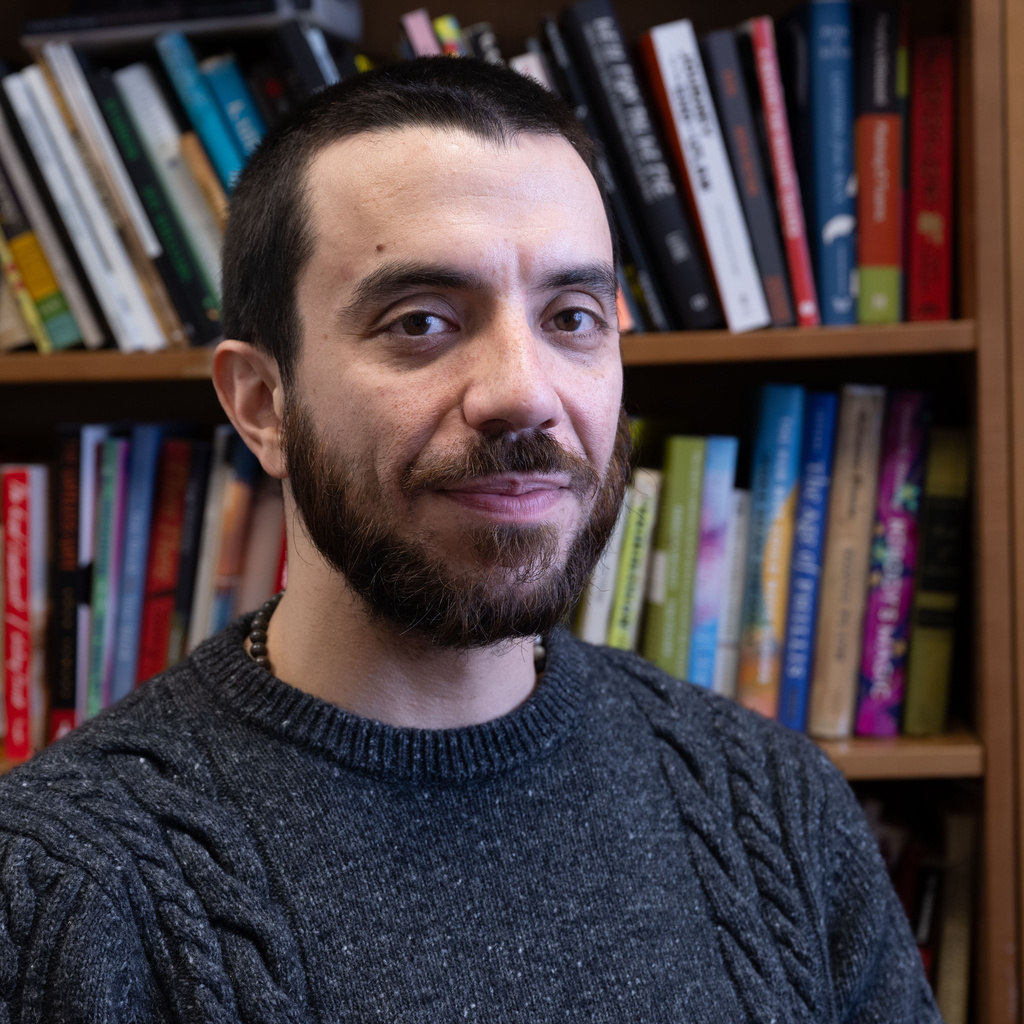 A headshot of University of Iowa professor Kevah Akbar. 