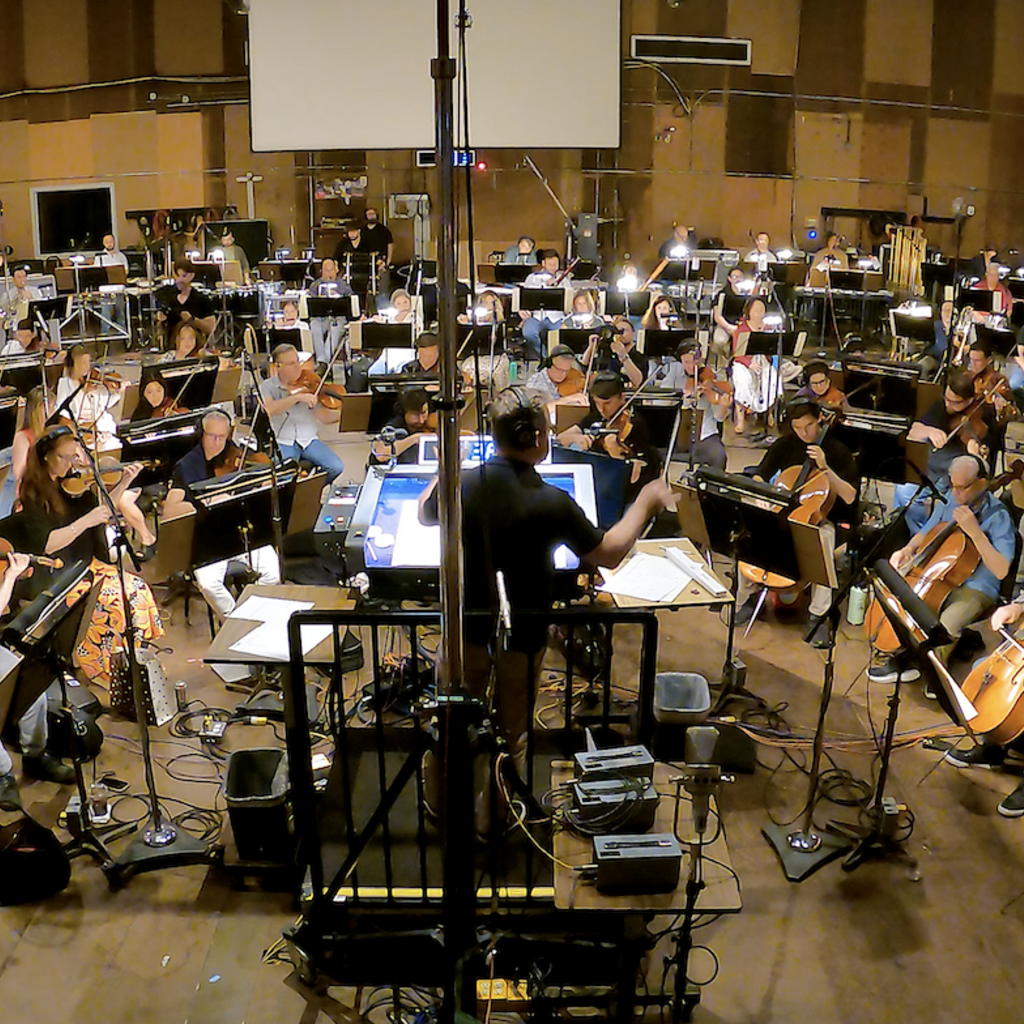 Alumni Scott Icenogle conducts his original composition, Ode to Voxman, for an 85-piece orchestra