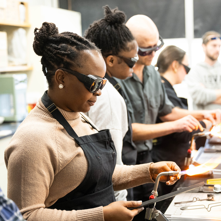 Daniel Newton’s University of Iowa Tippie workshop heads to the glassblowing studio in the Chemistry Building.