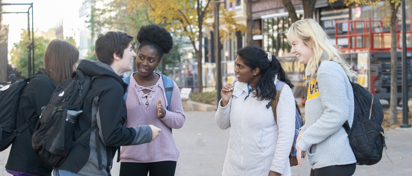 ASL students walking downtown talking and laughing