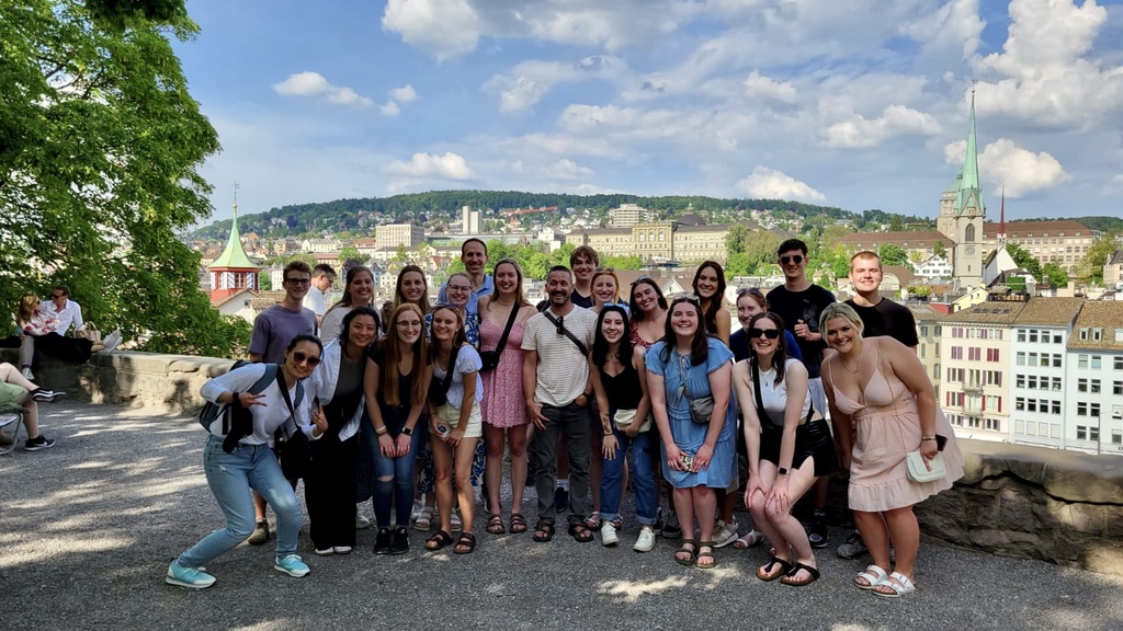 A group photo of students posing while traveling in Europe