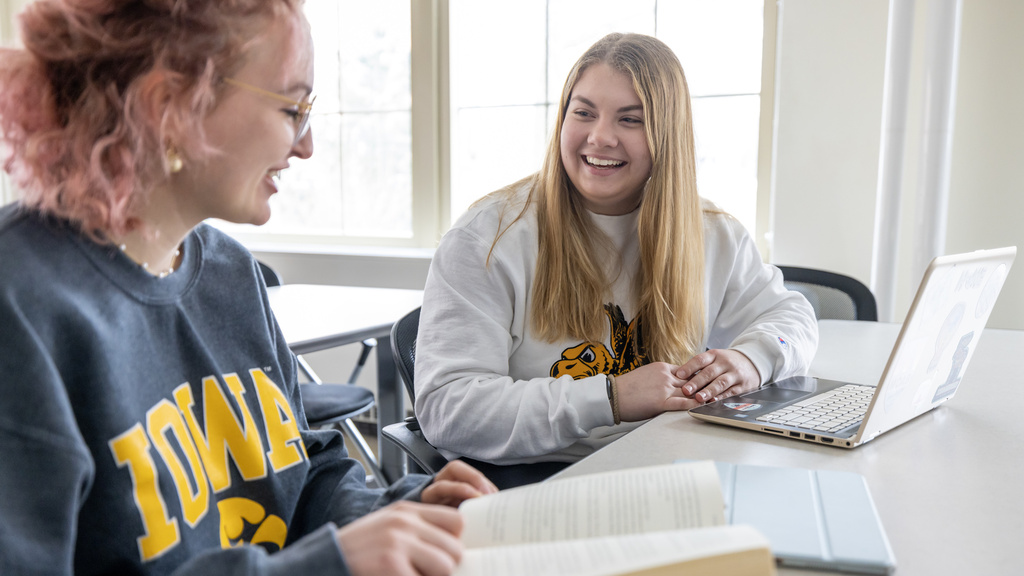 two students discussing in class