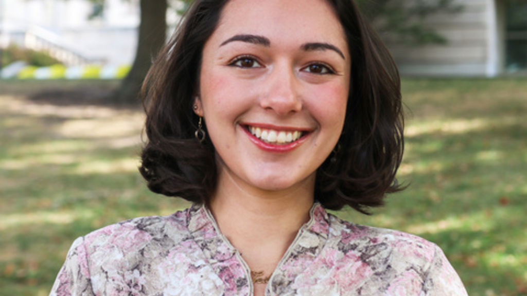Portrait of Leila Assadie in front of grass and trees