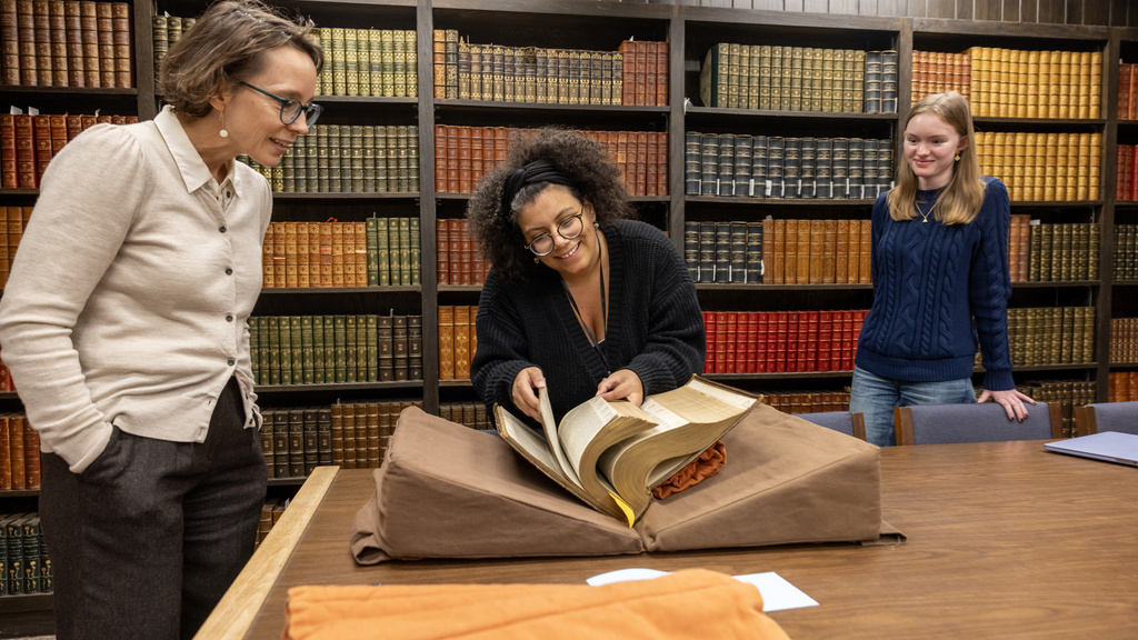 student in special collections with faculty