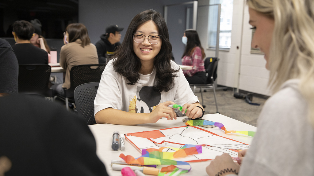 LLLC student in class working on a group project