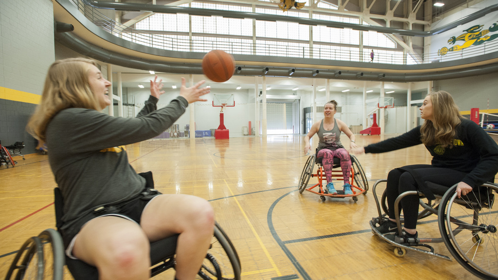 students playing basketball in wheelchairs