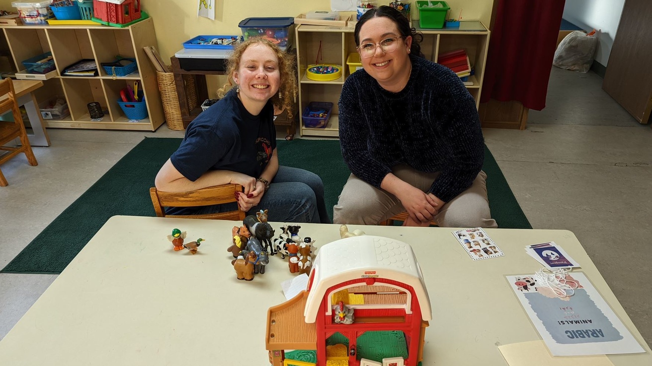 Emily Hartman (right) is one of several students participating in the project at Neighborhood Centers of Johnson County.