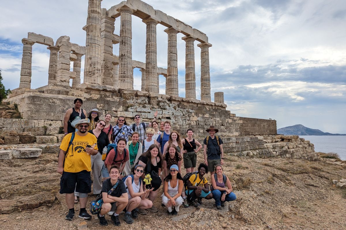 A group of students from the College of Liberal Arts and Sciences in front of the Temple of Poseidon in Sounion, Greece.