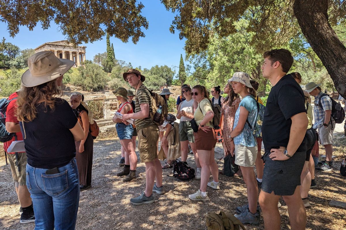 A photo of the group of students receiving a private tour from Assistant to the Director of the Agora excavations, Irene Dimitriadou.