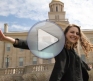 Still of video with student in front of Old Capitol
