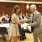 Director of Honors Program, Professor Art Spisak, congratulating a scholarship recipient