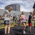 UISPEAKS campers tour Kinnick Stadium and run onto the field. 