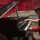 A student playing piano at the UI Summer Music Camps