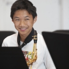 A student playing saxophone during the UI Summer Music Camps